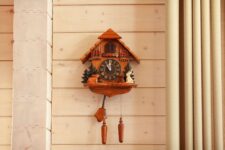 Cuckoo Clock on Wooden Panel Wall